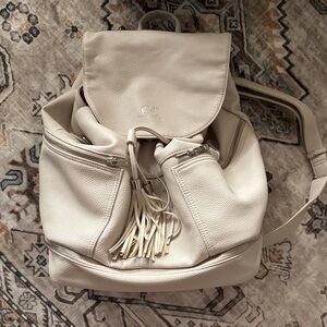 Pebbled Cream Drawstring Backpack with Tassel Detail